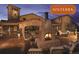 Inviting outdoor patio with a stone fireplace, comfortable seating, and elegant architectural details at 15525 W La Salle Ave, Lakewood, CO 80228