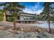 Spacious home with lower level walk out, cantilevered deck, walls of windows and contemporary styling at 11505 Conifer Ridge Dr, Conifer, CO 80433