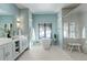 Bright, modern bathroom with a soaking tub, walk-in shower, and double sink vanity at 11505 Conifer Ridge Dr, Conifer, CO 80433