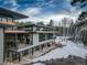 Multi-level home boasting a grand terrace, floor-to-ceiling windows, and beautifully integrated stone details at 11505 Conifer Ridge Dr, Conifer, CO 80433