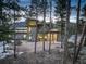 Stunning modern home showcasing unique architectural details and natural stone accents nestled among towering trees at 11505 Conifer Ridge Dr, Conifer, CO 80433