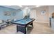 Recreation room with a pool table, wet bar, and seating area for entertaining guests at 11505 Conifer Ridge Dr, Conifer, CO 80433