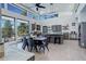 Bright, open-concept kitchen with eat in dining area, a large island, and great natural light from large windows at 11505 Conifer Ridge Dr, Conifer, CO 80433
