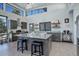 Bright, modern kitchen with an oversized island, breakfast bar and stainless steel appliances at 11505 Conifer Ridge Dr, Conifer, CO 80433