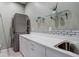 Efficient laundry room with stacked washer/dryer, ample counter space, and storage cabinets at 11505 Conifer Ridge Dr, Conifer, CO 80433