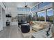 Bright living room featuring modern furniture, fireplace, large windows with views, and stylish decor at 11505 Conifer Ridge Dr, Conifer, CO 80433