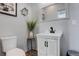 Well-lit powder room with modern fixtures, stylish mirror, and elegant decor at 11505 Conifer Ridge Dr, Conifer, CO 80433