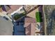 Aerial view of a home, including landscaped lawns, patio seating, and a driveway at 1828 Blue Oak Ct, Castle Rock, CO 80104