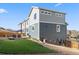 Townhouse backyard features a patio, lawn, and privacy fence, perfect for outdoor relaxation and entertainment at 1828 Blue Oak Ct, Castle Rock, CO 80104