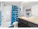 Bright bathroom featuring a shower-tub combination with a fun shark-themed shower curtain at 1828 Blue Oak Ct, Castle Rock, CO 80104