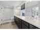 Bathroom featuring double sinks, vanity, tile flooring, and a stand-up shower at 1828 Blue Oak Ct, Castle Rock, CO 80104