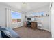 Cozy bedroom featuring a study desk, neutral color scheme, and natural light at 1828 Blue Oak Ct, Castle Rock, CO 80104