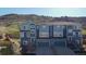 Modern townhouse with a two-car garage and a charming exterior, nestled near a scenic hillside at 1828 Blue Oak Ct, Castle Rock, CO 80104