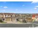 Two-story home with a three car garage, landscaped front yard, and scenic neighborhood view at 1828 Blue Oak Ct, Castle Rock, CO 80104