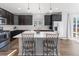 Modern kitchen featuring dark cabinets, stainless steel appliances and a bright center island at 1828 Blue Oak Ct, Castle Rock, CO 80104