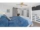 Comfortable main bedroom featuring a large bed and stylish sliding barn door at 1828 Blue Oak Ct, Castle Rock, CO 80104