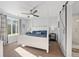 Spacious main bedroom with a four-poster bed and barn door to the bathroom at 1828 Blue Oak Ct, Castle Rock, CO 80104