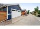 View of the home's two-car garage showing a neighborhood with a well-maintained alley at 3644 Wabash St, Denver, CO 80238
