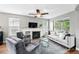 Spacious living room with a fireplace offers a comfortable seating area and plenty of natural light at 3644 Wabash St, Denver, CO 80238