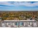 An aerial shot showcases residences surrounded by mature trees in a suburban neighborhood at 420 E Fremont Pl # 309, Centennial, CO 80122