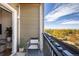 Enjoy outdoor living on the balcony, furnished with a chair and table, offering scenic views and a relaxing atmosphere at 420 E Fremont Pl # 309, Centennial, CO 80122