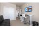 A versatile bedroom featuring a desk, media center, and sliding door closet at 420 E Fremont Pl # 309, Centennial, CO 80122