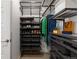 A walk-in closet featuring metal shelving, hanging rods, and well organized storage for clothes and accessories at 420 E Fremont Pl # 309, Centennial, CO 80122