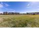 Expansive green space in front of modern townhomes, perfect for recreation and community events at 420 E Fremont Pl # 309, Centennial, CO 80122
