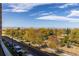 A scenic street view showcasing colorful fall foliage, a well-maintained road, and a distant mountain range under a blue sky at 420 E Fremont Pl # 309, Centennial, CO 80122