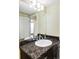 Bathroom vanity with granite countertop, oval sink, and modern fixtures at 2432 Champa St, Denver, CO 80205