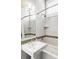 Elegant bathroom features a sleek sink, tiled backsplash and a bathtub for a modern look at 2432 Champa St, Denver, CO 80205
