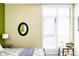 Bright bedroom featuring a comfortable bed, stylish decor and plantation shutters at 2432 Champa St, Denver, CO 80205
