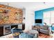 Stylish flex room featuring built-in bar area, comfortable seating, and entertainment options at 2432 Champa St, Denver, CO 80205