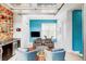 Versatile flex room with wet bar area, cozy seating, and entertainment options at 2432 Champa St, Denver, CO 80205