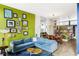 Open-concept living room flows into the dining area and kitchen with natural light at 2432 Champa St, Denver, CO 80205