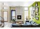 Bright living room features a fireplace, large windows, and blue accent rug at 2432 Champa St, Denver, CO 80205