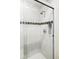 Modern shower with glass door, decorative tile and built-in shelving for a spa-like experience at 2432 Champa St, Denver, CO 80205