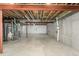 Spacious unfinished basement featuring exposed ceiling and concrete walls, offering potential for customization at 22163 E Calhoun Pl, Aurora, CO 80016