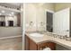 Powder room with a mirror, vanity, and attractive decor at 22163 E Calhoun Pl, Aurora, CO 80016