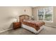 This bedroom has a large window, vaulted ceiling, and neutral walls at 22163 E Calhoun Pl, Aurora, CO 80016