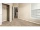 Cozy bedroom with plush carpet and ample natural light through large window at 22163 E Calhoun Pl, Aurora, CO 80016