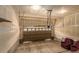 Spacious garage featuring a brown sectional door, perfect for parking and storage at 22163 E Calhoun Pl, Aurora, CO 80016