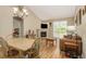 A bright living room with a fireplace, wood floors, and sliding glass doors offers a comfortable gathering space at 22163 E Calhoun Pl, Aurora, CO 80016
