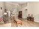 Spacious living and dining area with high ceilings, an open floor plan, and stylish decor, perfect for modern living at 22163 E Calhoun Pl, Aurora, CO 80016