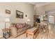 Comfortable living area featuring a sofa, dining table, and access to the kitchen, promoting a seamless flow at 22163 E Calhoun Pl, Aurora, CO 80016