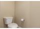 Simple powder room featuring a white toilet, toilet paper holder, and neutral-colored walls at 22163 E Calhoun Pl, Aurora, CO 80016