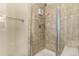 Tiled shower with sleek glass doors and a convenient showerhead at 22163 E Calhoun Pl, Aurora, CO 80016