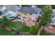 Aerial view of the home showcasing an expansive yard, patio area, and lush greenery at 18126 E Alamo Dr, Centennial, CO 80015