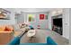 Inviting finished basement features a sectional sofa, a modern entertainment area, and a fun dartboard at 18126 E Alamo Dr, Centennial, CO 80015