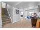 Finished basement area offering extra living space, fitness equipment, and stairs leading to upper level at 18126 E Alamo Dr, Centennial, CO 80015